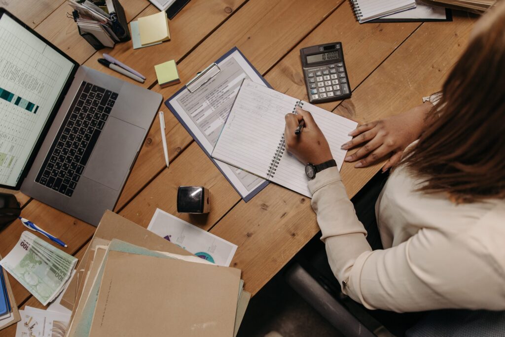 Person in White Long Sleeve Shirt Holding White Paper